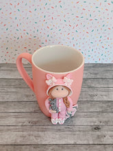 Load image into Gallery viewer, Handmade Polymer Clay 3D Girl in Pink Bunny PJs on a Pink Ceramic Mug

