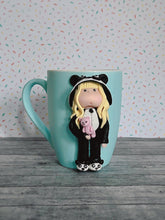 Load image into Gallery viewer, Handmade Polymer Clay 3D Blonde Girl in Panda PJs on a Blue Ceramic Mug

