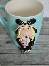 Load image into Gallery viewer, Handmade Polymer Clay 3D Blonde Girl in Panda PJs on a Blue Ceramic Mug
